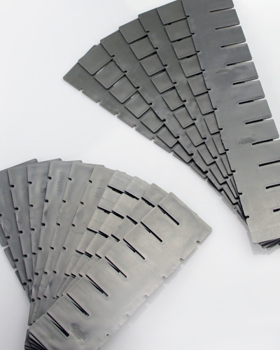 Lewis bins arranged on shelving, filled with assorted clinical supplies for organized storage.