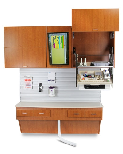Clinical Manhattan cabinetry with upper and lower storage units and integrated workspace.